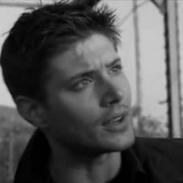 dean winchester, a conventionally attractive man with military-style short hair, looks confused.